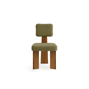 The Lena dining chair with wooden legs, showcasing a sleek and minimalist design.